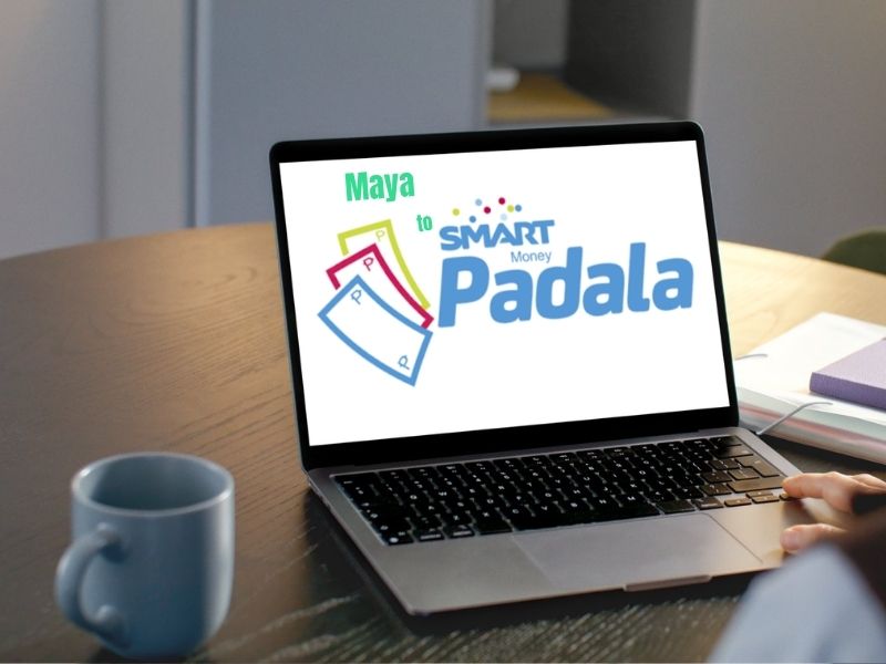 Laptop screen showing "Maya to Smart Padala" graphic on a desk, illustrating online money transfer services.