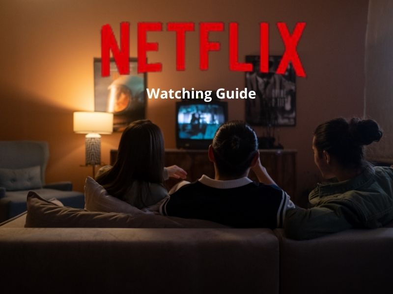 A rear-view image shows three people sitting together on a comfortable sofa in a living room, with the focus on a lit television screen in the background. Above the scene is the Netflix logo with the white text "Viewing Guide."