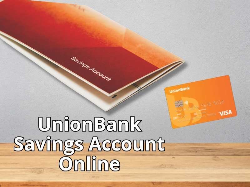 A UnionBank orange debit Visa card and a passbook labeled "Savings Account" on a wooden and grey background, with the overlay text "UnionBank Savings Account Online".